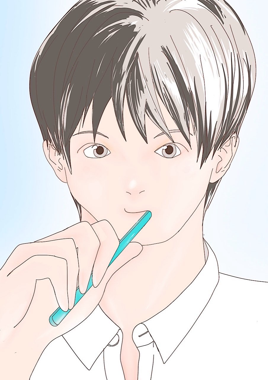 A boy brushing his teeth